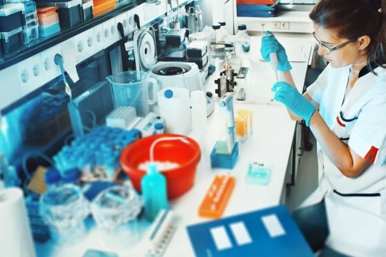 a person maintaining their lab equipment.