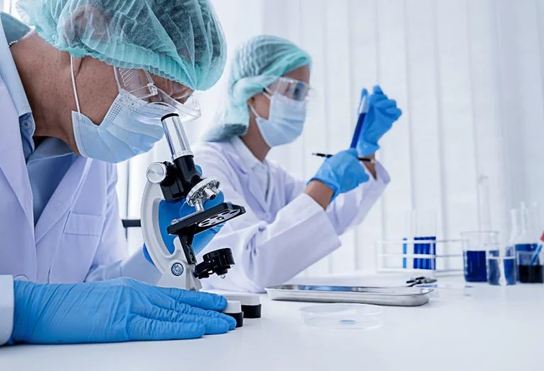 Scientists using laboratory equipment