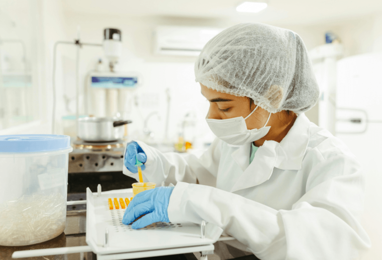 Lab technician using lab equipment