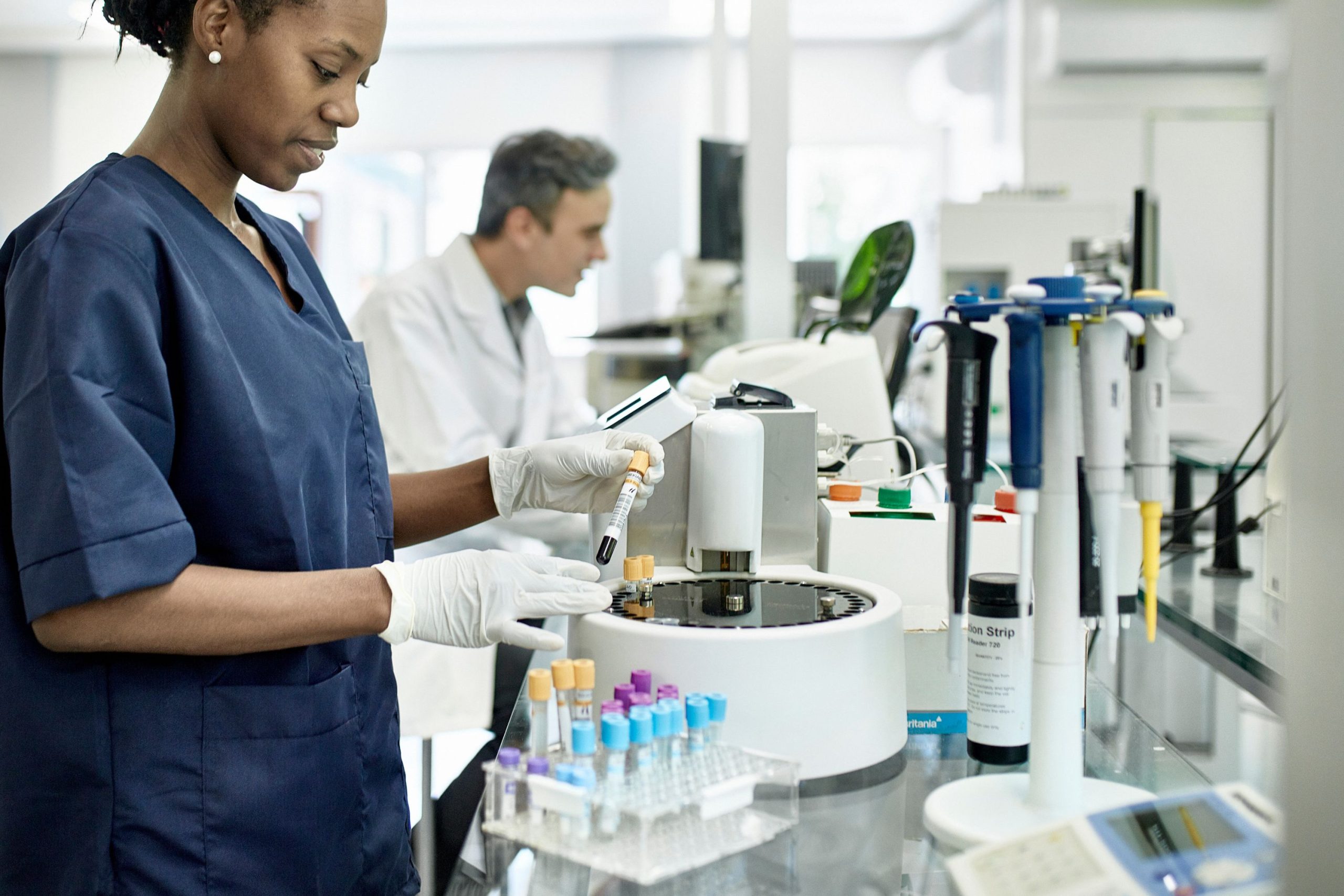 scientists using pathology lab equipment in a pathology lab